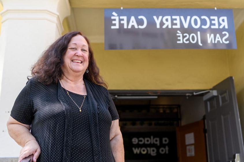 Kathy Cordova standing in front of the Recovery Cafe..